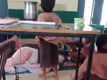 X : The video, said to be of a government school, shows shows the students taking turns to fan the teacher as she sleeps.

